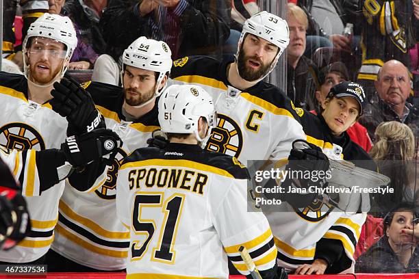 Ryan Spooner of the Boston Bruins celebrates his first period goal against the Ottawa Senators with team mates Dougie Hamilton, Adam McQuaid, Zdeno...