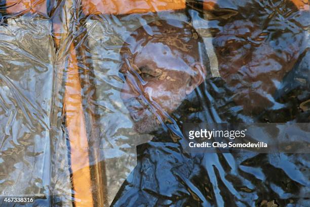 Afghanistan President Ashraf Ghani rides inside a covered golf cart after he and Afghanistan Chief Executive Abdullah Abdullah arrived at Camp David...