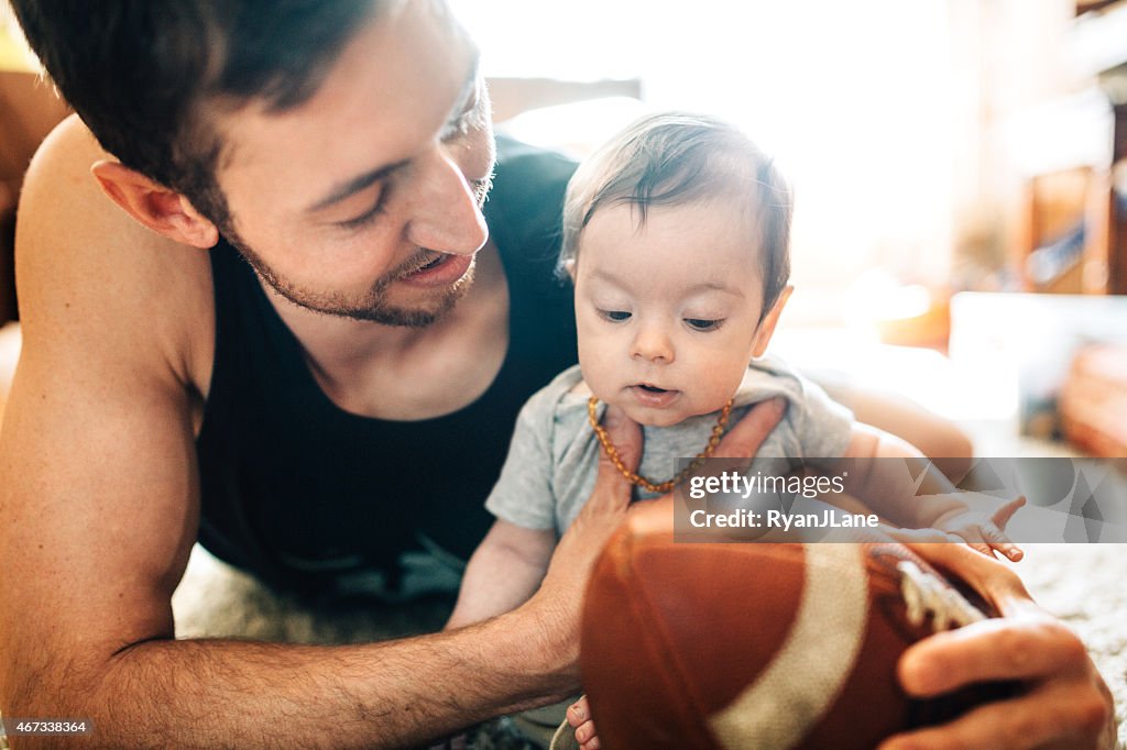 Dad Playing with Infant Son
