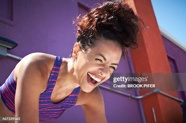 young fit woman laughing - sports clothing stock pictures, royalty-free photos & images