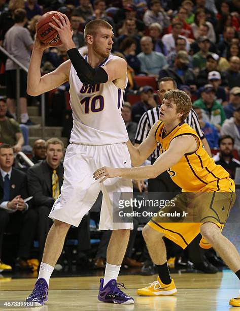 Seth Tuttle of the UNI Panthers in action against Jason McManamen of the Wyoming Cowboys during the second round of the 2015 Men's NCAA Basketball...