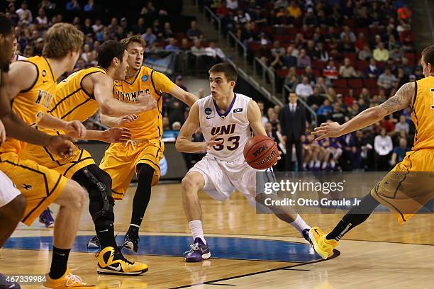 Wyatt Lohaus of the UNI Panthers dribbles against the Wyoming Cowboys during the second round of the 2015 Men's NCAA Basketball Tournament at Key...