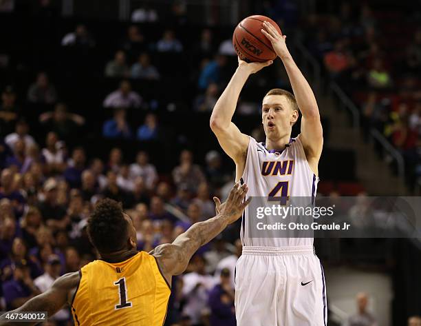 Paul Jesperson of the UNI Panthers in action against Charles Hankerson Jr. #1 of the Wyoming Cowboys during the second round of the 2015 Men's NCAA...