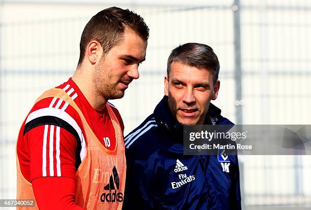 Head coach Peter Knaebel of Hamburg talks to Pierre Michel Lasogga during the of Hamburger SV training session on March 23, 2015 in Hamburg, Germany.