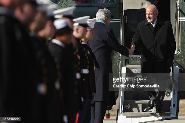 Secretary of State John Kerry greets Afghanistan President Ashraf Ghani as they arrive at Camp David ahead of talks March 23, 2015 in Camp David,...