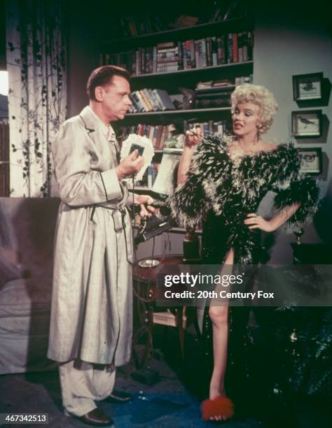 American actors Marilyn Monroe and Tom Ewell in a scene from the film 'The Seven Year Itch', directed by Billy Wilder, 1955.