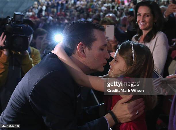 Sen. Ted Cruz kisses his daughter Caroline Cruz before walking onstage to speak at Liberty University to announce his presidential candidacy March...