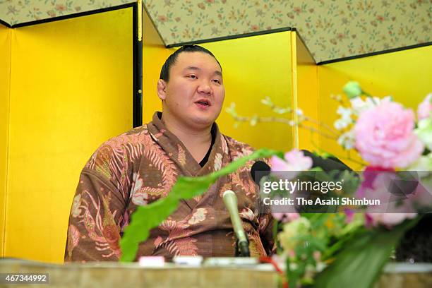 Mongolian yokozuna, sumo grand champion Hakuho speaks during a press conference a day after winning the Grand Sumo Spring Tournament on March 23,...