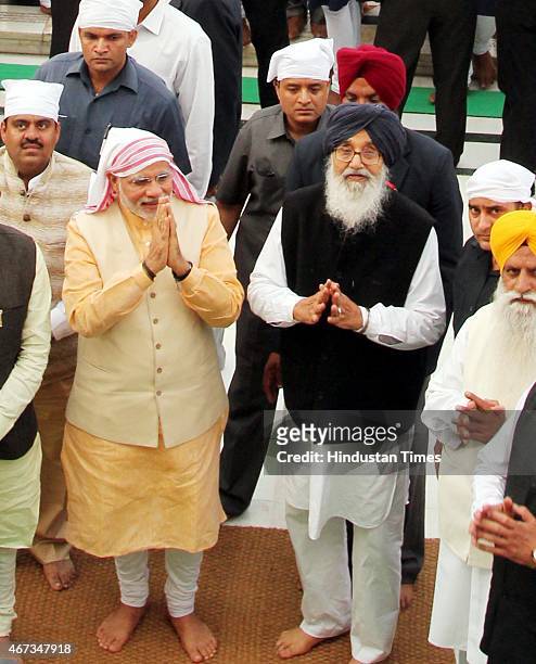 India Prime Minister Narendra Modi along with Punjab Chief Minister Parkash Singh Badal during his visit to pay obeisance at Golden Temple on March...