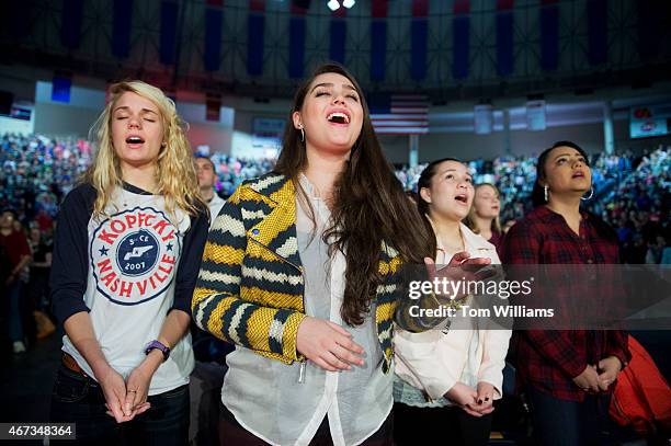 Damaris Braz Perez center, sings during a convocation at Liberty University's Vines Center in Lynchburg, Va., before Sen. Ted Cruz, R-Texas,...