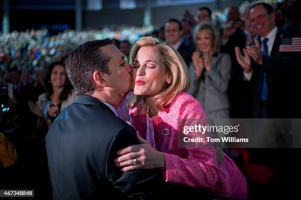 Sen. Ted Cruz, R-Texas, kisses his wife Heidi during a convocation at Liberty University's Vines Center in Lynchburg, Va., where he announced his...