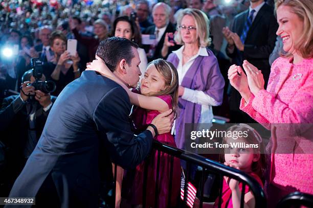 Sen. Ted Cruz, R-Texas, hugs his daughter Caroline as his other daughter Catherine and wife Heidi, look on, during a convocation at Liberty...