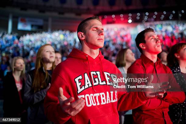 Zach Swenski sings during a convocation at Liberty University's Vines Center in Lynchburg, Va., before Sen. Ted Cruz, R-Texas, announced his...
