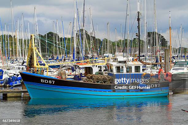 botas floatng in lymington harbour - lymington stock pictures, royalty-free photos & images