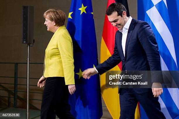 German Chancellor Angela Merkel and Greek Prime Minister Alexis Tsipras depart after speaking to the media following talks at the Chancellery on...