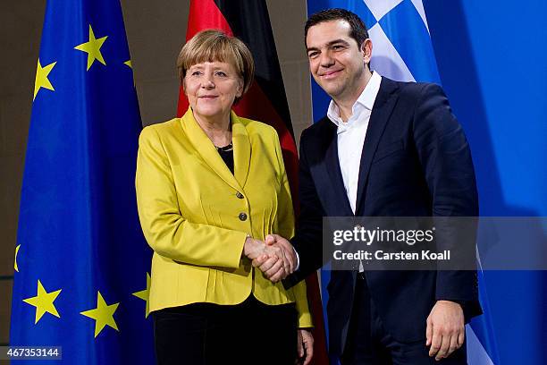 German Chancellor Angela Merkel and Greek Prime Minister Alexis Tsipras depart after speaking to the media following talks at the Chancellery on...