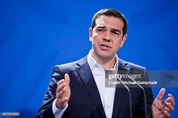 Greek Prime Minister Alexis Tsipras speaks to the media following talks with German Chancellor Angela Merkel at the German Chancellery on March 23,...