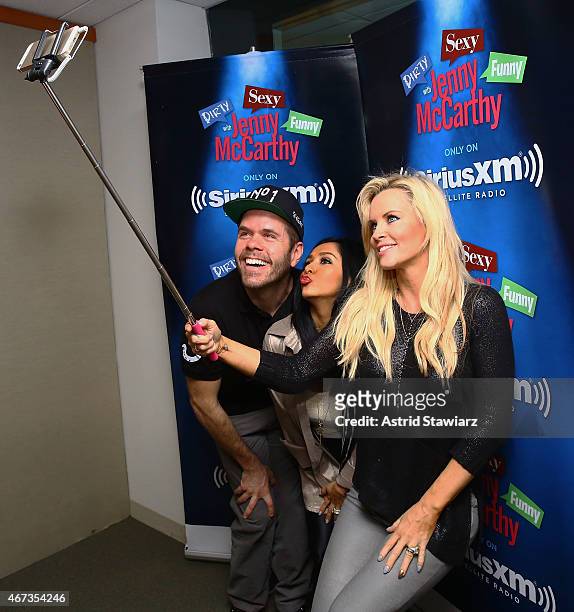 Personalites Perez Hilton and Nicole 'Snooki' Polizzi pose for a selfie with host Jenny McCarthy during a visit to 'Dirty, Sexy, Funny with Jenny...