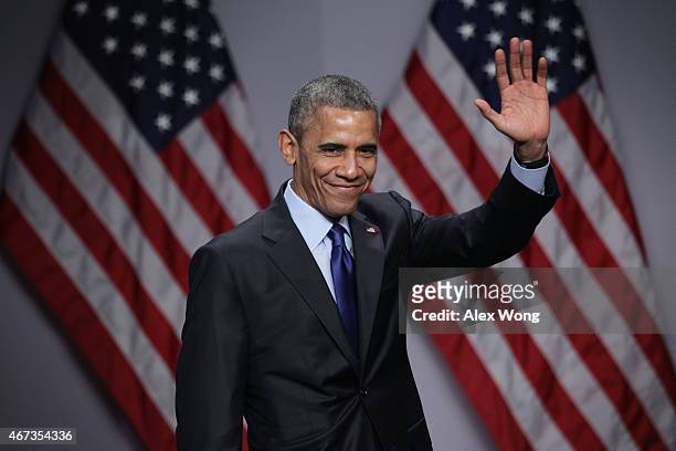 President Barack Obama waves after he spoke during the SelectUSA Investment Summit March 23, 2015 in National Harbor, Maryland. The summit brought...