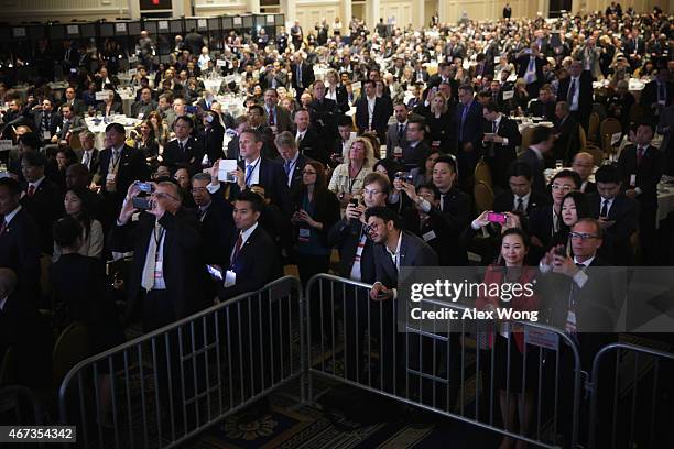 Attendees listen as U.S. President Barack Obama speaks during the SelectUSA Investment Summit March 23, 2015 in National Harbor, Maryland. The summit...