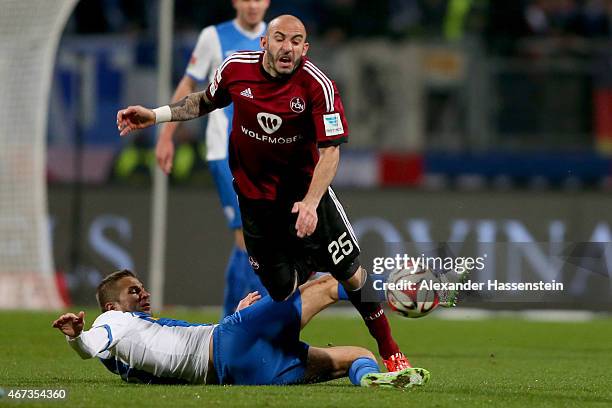 Javier Pinola of Nuremberg is challenged by Stanislav Sestak of Bochum during the Second Bundesliga match between 1. FC Nuernberg and VfL Bochum at...