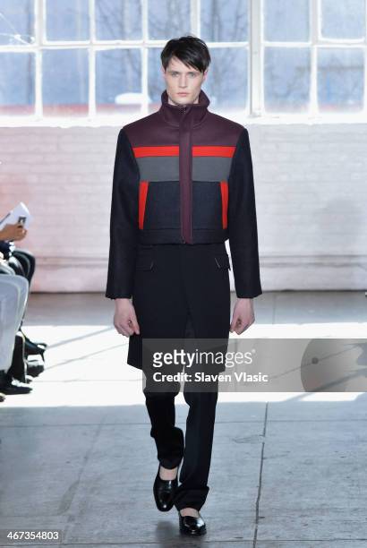 Model walks the runway at the Duckie Brown fashion show during Mercedes-Benz Fashion Week Fall 2014 at Industria Superstudio on February 6, 2014 in...