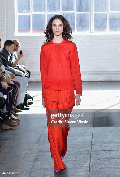 Model walks the runway at the Duckie Brown fashion show during Mercedes-Benz Fashion Week Fall 2014 at Industria Superstudio on February 6, 2014 in...