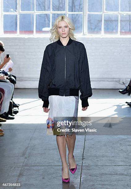 Model walks the runway at the Duckie Brown fashion show during Mercedes-Benz Fashion Week Fall 2014 at Industria Superstudio on February 6, 2014 in...