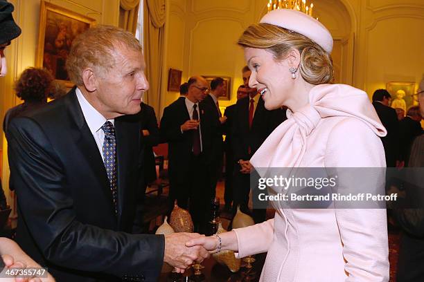 Journalist Patrick Poivre d'Arvor and Queen Mathilde Of Belgium attend the King Philippe of Belgium and Queen Mathilde Of Belgium visit the Residence...