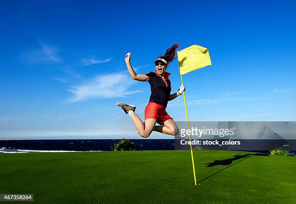 jumping with golf ball - golf accessories stock pictures, royalty-free photos & images