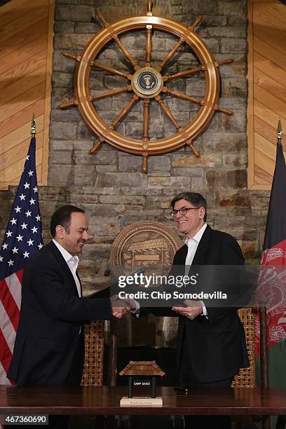 Afghanistan Finance Minister Eklil Hakimi and U.S. Treasury Secretary Jacob Lew shake hands after signing a memorandum of understanding during talks...