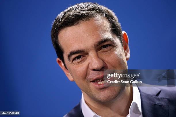 Greek Prime Minister Alexis Tsipras speaks to the media with German Chancellor Angela Merkel following talks at the Chancellery on March 23, 2015 in...