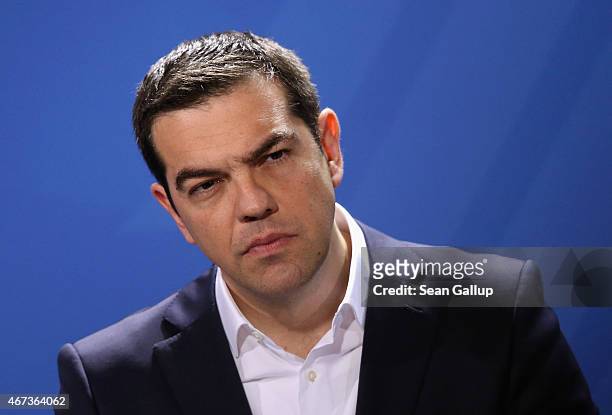 Greek Prime Minister Alexis Tsipras speaks to the media with German Chancellor Angela Merkel following talks at the Chancellery on March 23, 2015 in...