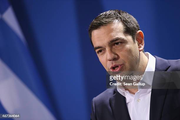 Greek Prime Minister Alexis Tsipras speaks to the media with German Chancellor Angela Merkel following talks at the Chancellery on March 23, 2015 in...