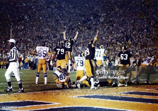 Quarterback Terry Bradshaw of the Pittsburgh Steelers along with other teammates celebrate after scoring a touchdown during Super Bowl XIV against...