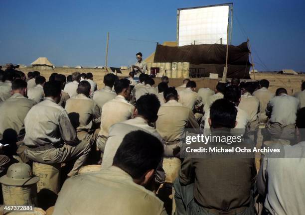 View as U.S. Solders listen in a group at the U.S Air Force base in Benghazi, Libya.