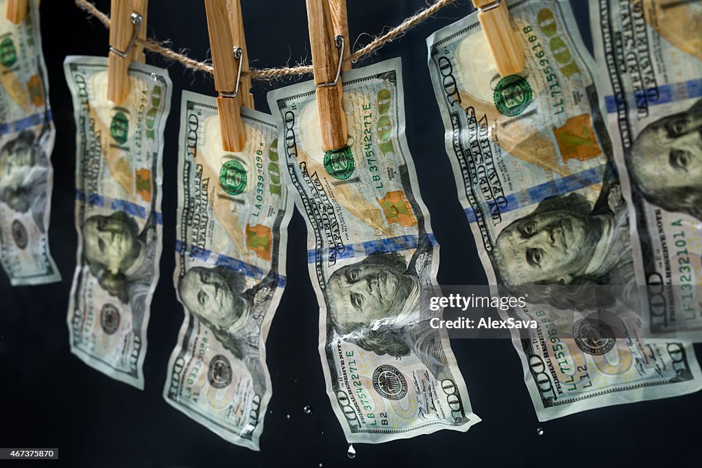 Laundered dollars hanging on a rope