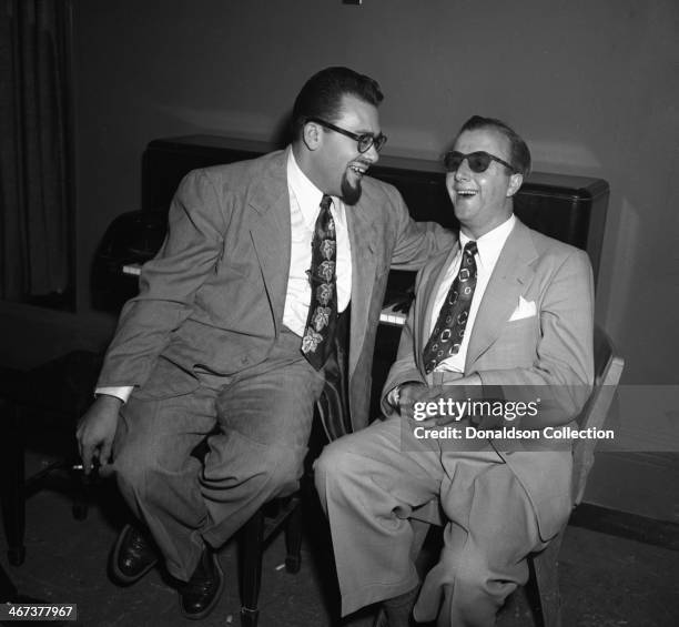 Musicians George Shearing and Al "Jazzbo" Collins backstage at Carnegie Hall on November 11, 1952 in New York, New York.