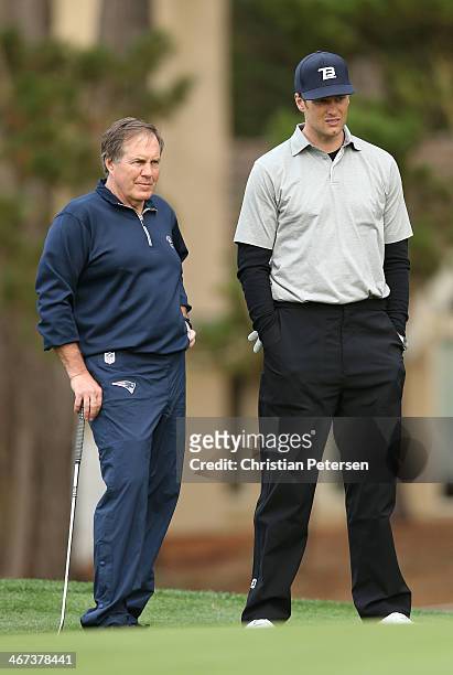 Football coach Bill Belichick and professional football player Tom Brady stand on the 17th hole green during the first round of the AT&T Pebble Beach...
