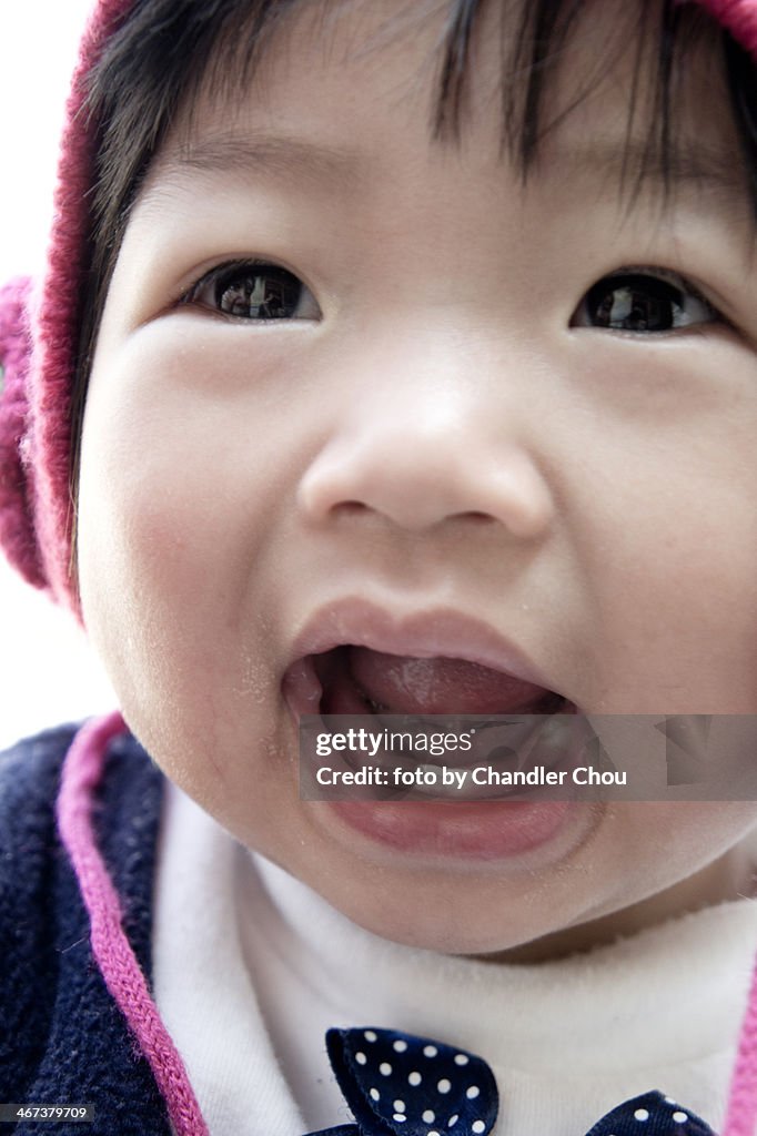 Baby girl with little teeth