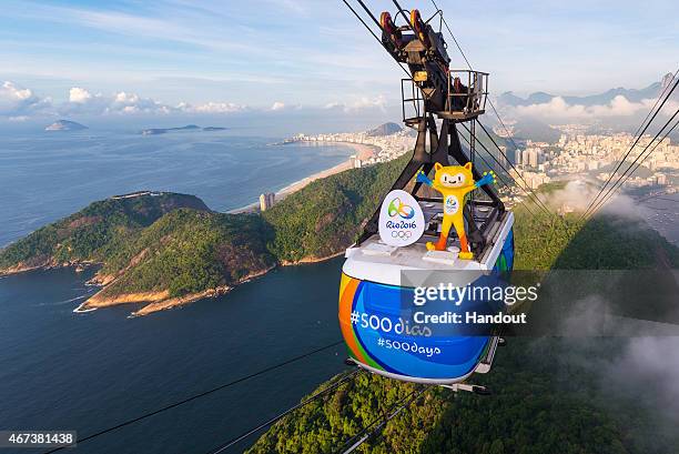 In this handout image provided by Rio 2016, Olympic mascot, Vinicius, rides from the top of the Sugarloaf cable on March 23, 2015 in Rio De Janeiro,...