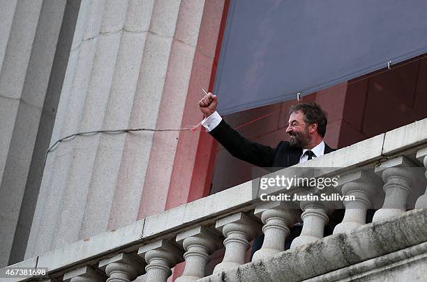 Actor Ian Beattie waves to fans from a balcony during the premiere of HBO's 'Game of Thrones' Season 5 at San Francisco Opera House on March 23, 2015...