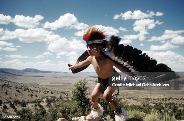 Young Native American boy learns the Eagle Dance in Grand Canyon National Park, Arizona.