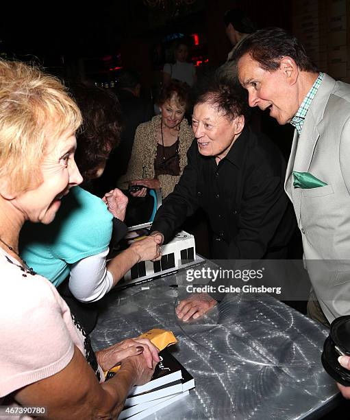 Actor/comedian Marty Allen and impressionist Rich Little greet fans during a meet and greet after Allen's performance at the Downtown Grand Hotel &...