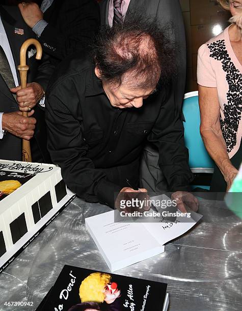 Actor/comedian Marty Allen signs a copy of his book "Hello Dere! An Illustrated Biography" during a meet and greet after his performance at the...