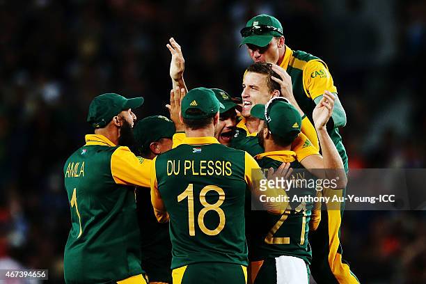 Morne Morkel of South Africa celebrates with the team after getting the wicket of Kane Williamson of New Zealand during the 2015 Cricket World Cup...