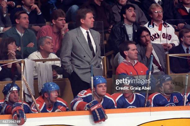 December 14: Coach Glen Sather of the Edmonton Oilers watches the play from behind the bench against the Toronto Maple Leafs on December 14, 1988 at...