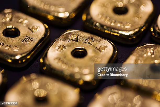 Gold bars, each weighing one tael , are arranged for a photograph inside a Chow Sang Sang Holdings International Ltd. Jewelry store in Hong Kong,...