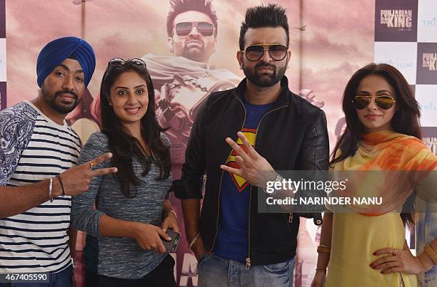 Indian actresses Keeya Khanna and Bhanushree , and Punjabi singers and actors Navraj Hans and Jarnail Singh pose for a photograph during a...