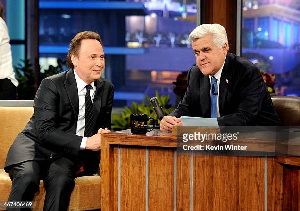Actor Billy Crystal and comedian Jay Leno appear onstage during a commercial break on the final episode of "The Tonight Show with Jay Leno" at The...
